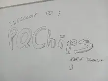 napis "welcome to PQChips 2026 August" na tablicy
